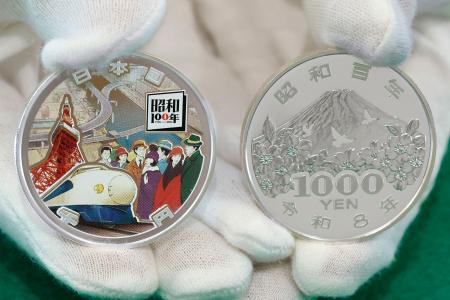 昭和の歴史ぎゅっと銀貨に 100年記念、打ち初め式 | 高知新聞